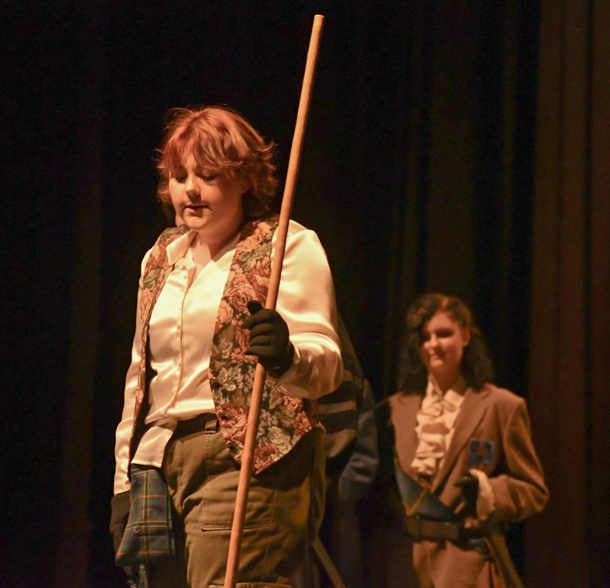 Molly Sky Utley as Banquo begins to suspect Macbeth.