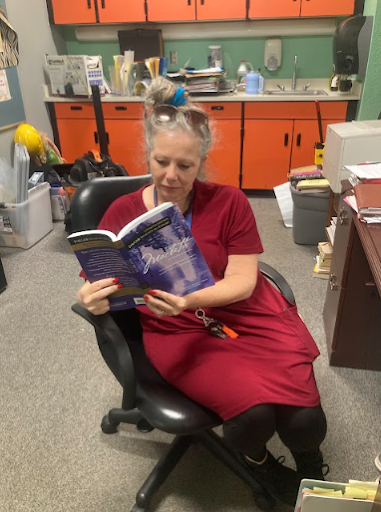 Mrs. B reading her favorite book: Macbeth.