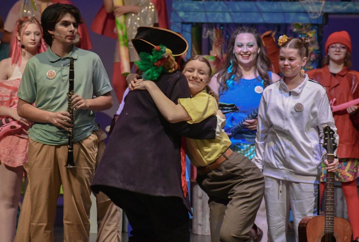 SpongeBob (Alma Jacobson) embracing her biggest fan, Patchy the Pirate (Molly Utley) after the performance.
