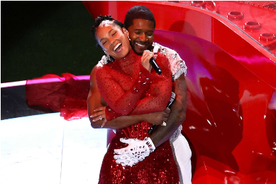 Photo of Usher and Alicia Keys hugging. From “People”