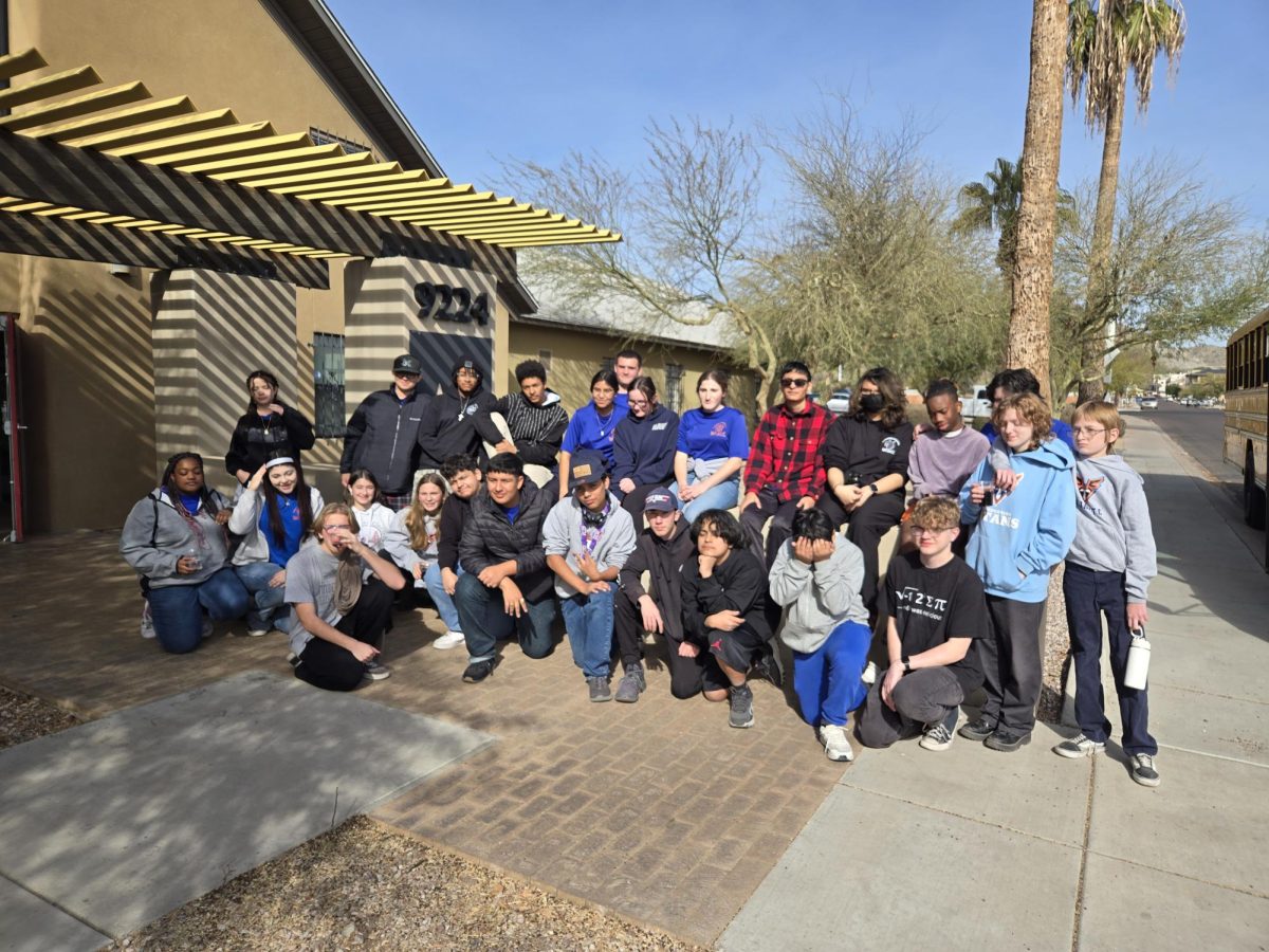 NJROTC cadets pose for a group photo outside Phoenix Assistance League.