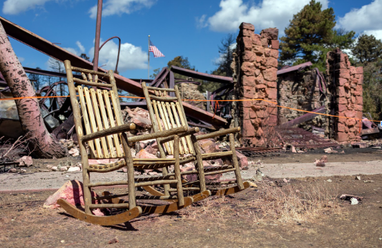 Dragon Bravo Fire - NPS Photo from July 18, 2025
Two rocking chairs that survived the Dragon Bravo Fire when it destroyed Grand Canyon Lodge July 12-13, 2025. The remains of the lodge are visible in the background. NPS Photo/Matt Jenkins
