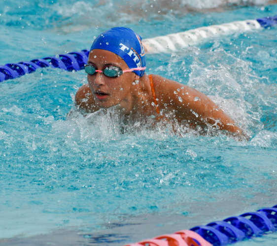 A Titan swimmer competes in a swim meet. Picture courtesy of THS Yearbook.
