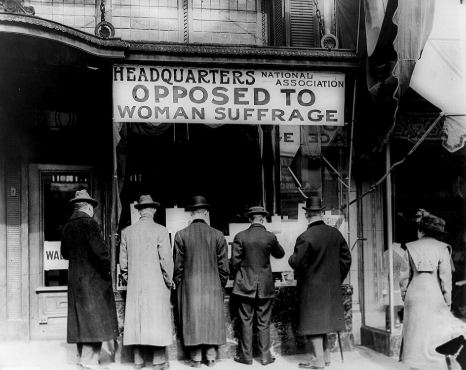 Men in front of the headquarters of the National Association Opposed to Woman Suffrage.