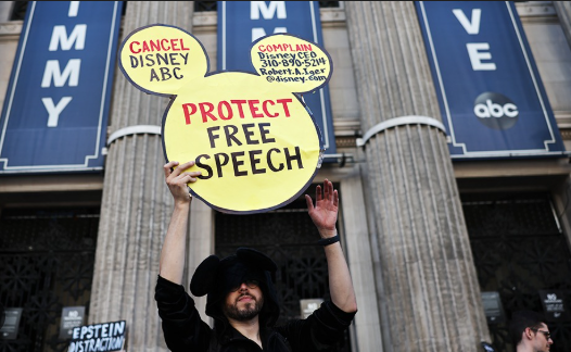 A demonstrator waves a "Protect Free Speech" sign following a protest against the suspension of the "Jimmy Kimmel Live!" show, held near the theater where the show is produced in Hollywood, on September 22 Photo Courtesy of Freedom Forum