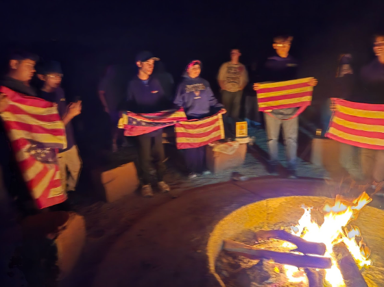 Cadets gather around a fire for the flag retirement ceremony. Photo credit to NJROTC.

