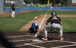 Senior J.P. Stewart sliding into home.


